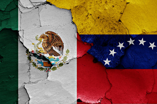 flags of Mexico and Venezuela painted on cracked wall