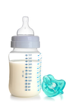 Baby milk bottle with pacifier, isolated on white