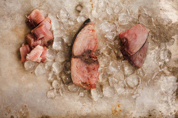 Red Tuna or albacore meat on a ice table, ready to prepare bbq food. 