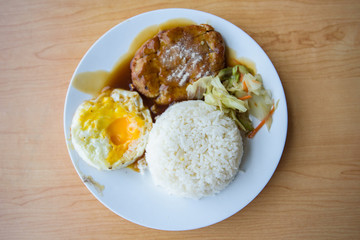 pork steak and fried egg with rice 
