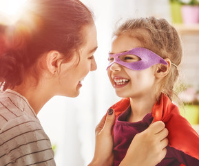 Mother and child girl playing