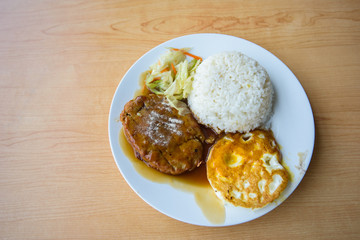 pork steak and fried egg with rice 
