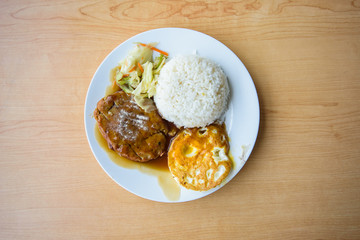 pork steak and fried egg with rice 