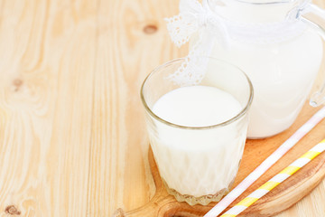 Glass jug and glass with milk