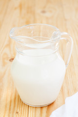 Glass jug with milk