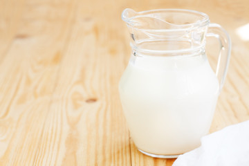Glass jug with milk