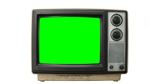 Dirty Grungy vintage television on white with zoom into chroma green screen.