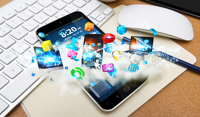 Tech devices and cloud over modern mobile phone © sdecoret