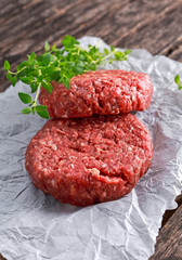 Home HandMade Raw Minced Beef steak burgers on scrumbled paper