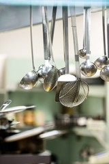 Close-up of hanging kitchen utensils