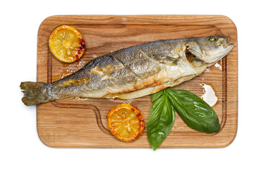 Grilled seabass on the wooden board