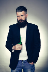 Bearded man with beer bottle