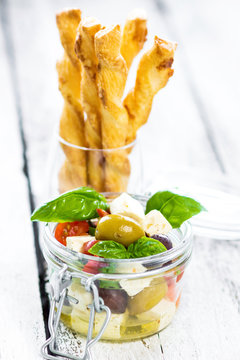 Delicious vegetable tapas in a glass with crunchy homemade grissini.