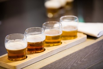 Close-up of beer glasses on the counter