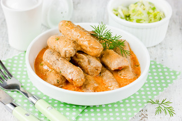 Fingers of pork fillet in sauce