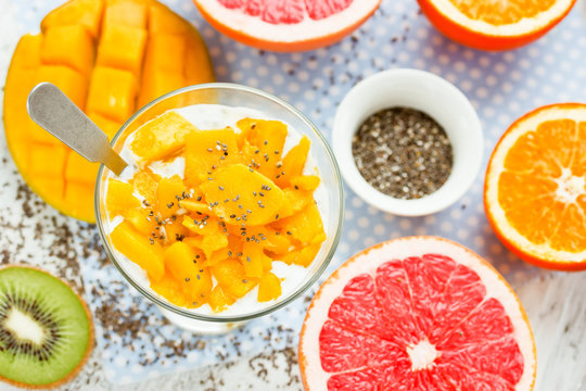 Mango chia pudding with fresh citrus fruit for breakfast