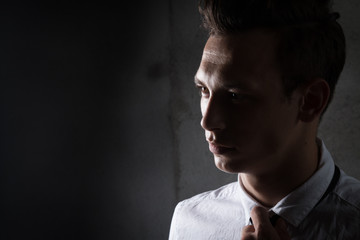 Fototapeta premium young business man style, fashion the financial sector, piercing glance confident,