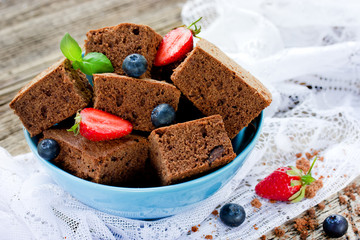 American chocolate cake brownie with summer fruits and berries