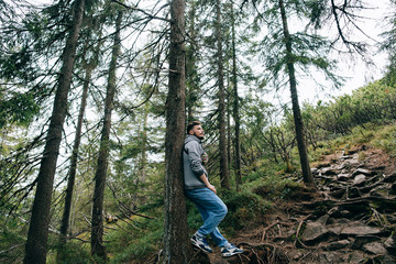 Bearded man in mountain forest