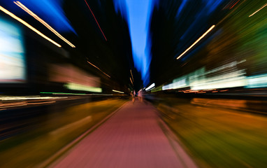 Night city accelerating blurred motion walking people. Speed concept