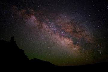 Colourful Milky Way over Rocks. Chimney Rock at Capitol Reef National Park, Utah, USA. 