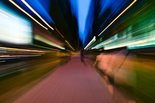 Night city accelerating blurred motion walking people. Speed concept