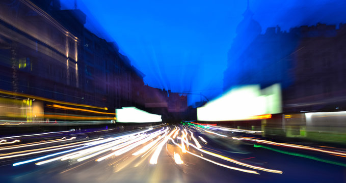 Evening city traffic lights speed blurred  motion
