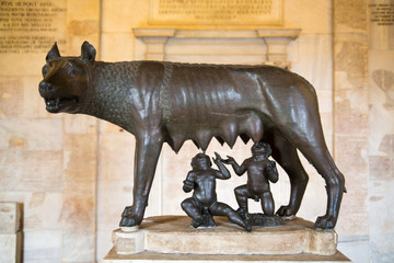 ROME, ITALY - APRIL 8, 2016:  Sculpture of a mother-wolf feeding Romulus and Remus, Rome, Italy