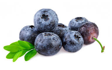 Blueberries on white, organic berries with leaves.