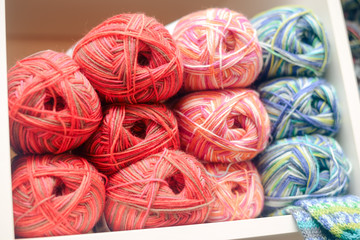 Knitting yarn on shelf, photo closeup 