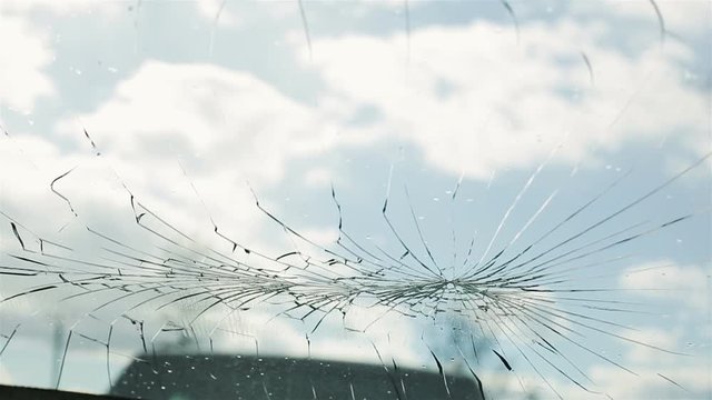 The airbag fired and broke the windshield