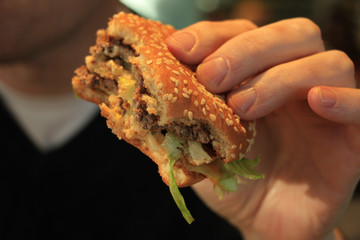 Man holding a hamburger