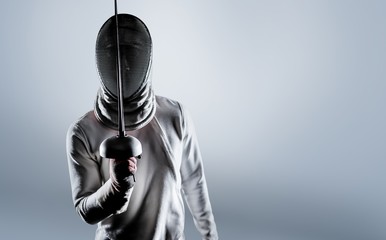 Composite image of man wearing fencing suit practicing with sword