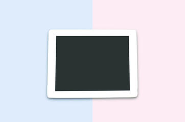 Black tablet on  colour background