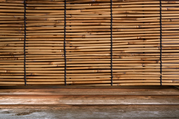 Perspective Wood Table with Bamboo Curtain Retro Background