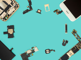 Flat lay (Top view) of smart phone components isolate on blue background with copy space