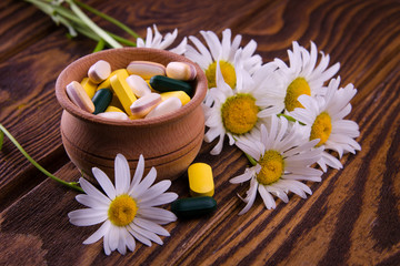 Obraz na płótnie Canvas Organic pills with camomile