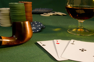 Poker concept with cards on green table