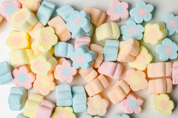 Fototapeta na wymiar Colorful marshmallows background,flower shape
