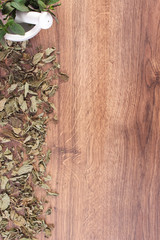 Dried and fresh green mint with mortar, healthy lifestyle, copy space for text