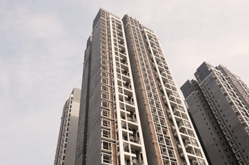 Fototapeta premium low angle view of modern apartment skyscraper