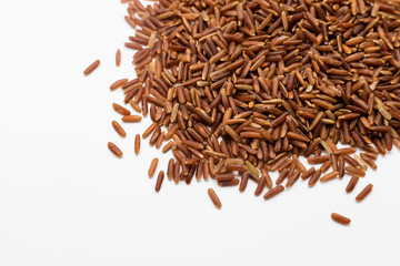 Uncooked brown rice on white background