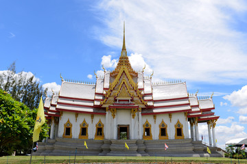 Beautiful Thai sculpture temple and and Blue sky with Clouds background.