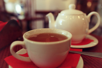 teapot and cup of tea at a cafe