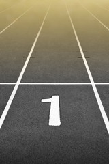 Dark Run Track at Stadium with Golden Light and Number One