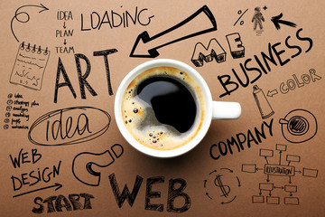 Cup of coffee on brown background, top view. Start up concept - obrazy, fototapety, plakaty