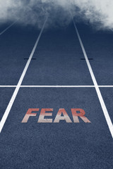 Fototapeta premium Dark Run Track at Stadium with Fog Smoke and Fear Word