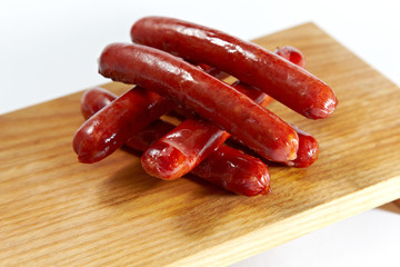 Sausage roasted on the grill on a white background