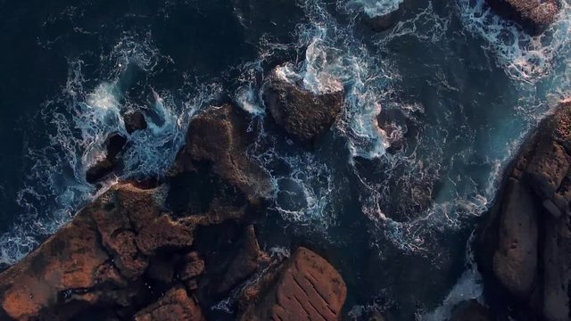 Beautiful View of rock pools on coastline in Taiwan waves crashing Aerial Shot 
