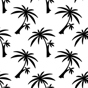 Seamless pattern with silhouettes palm trees